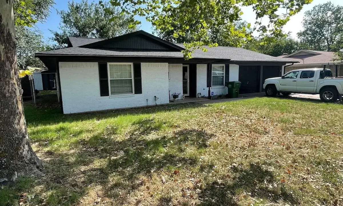 Professional roofing crew working on a residential roof in Meridian